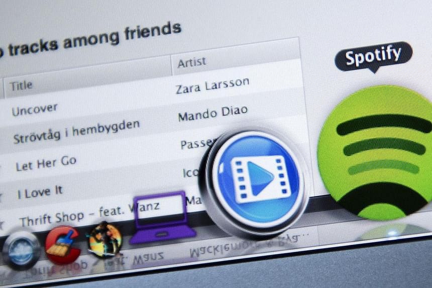 This photo illustration shows the Swedish music streaming service Spotify on March 7, 2013, in Stockholm, Sweden.&nbsp;Music streaming giant Spotify declined to comment Friday on reports that it is raising new funds that could delay a public listing.
