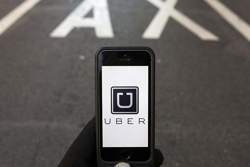 App-based ride service Uber, and smaller rival Lyft, face separate lawsuits seeking class action status in San Francisco federal court. -- PHOTO: REUTERS