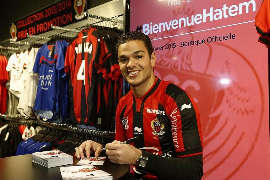 Nice's French midfielder Hatem Ben Arfa signs autographs in Nice on Jan 5, 2015. -- PHOTO: AFP&nbsp;