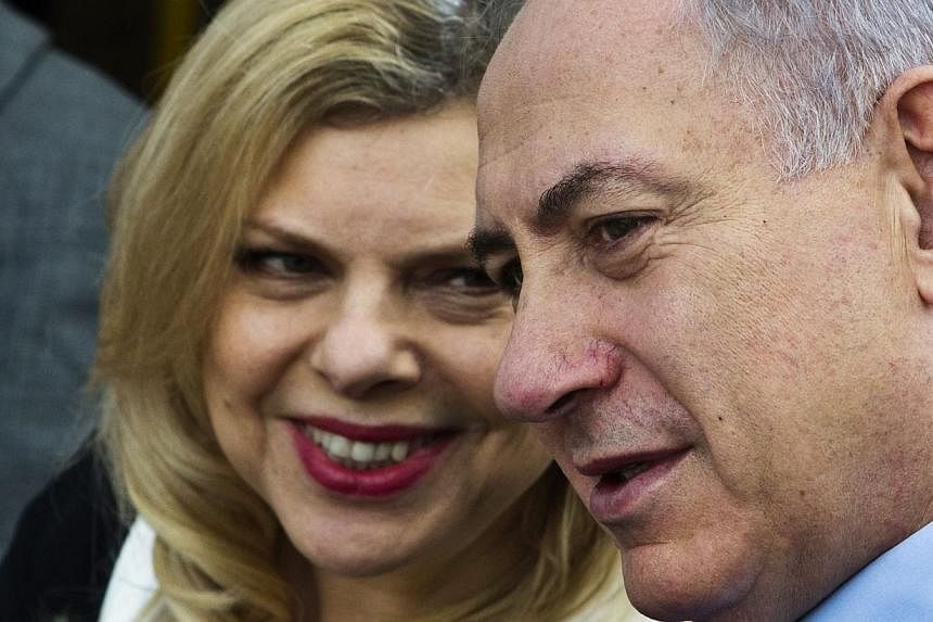 Israel's Prime Minister Benjamin Netanyahu (right) on Friday dismissed as "false" reports that his wife Sara (left) had pocketed at least US$1,000 (S$1,300) worth of public money by returning empty bottles to supermarkets. -- PHOTO: REUTERS