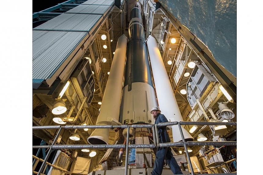 This NASA photo released on Jan 29, 2015, a worker preparing the launch gantry to be rolled back from the United Launch Alliance Delta II rocket with Soil Moisture Active Passive (SMAP) observatory onboard, at the Space Launch Complex 2, on Jan 28, 2