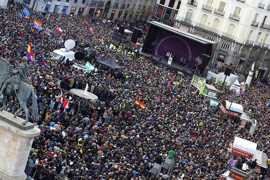 Tens of thousands of people took to the streets in Madrid on Saturday (above) in support of new anti-austerity party Podemos, a week after Greece elected its hard-left ally Syriza.&nbsp;-- PHOTO: AFP