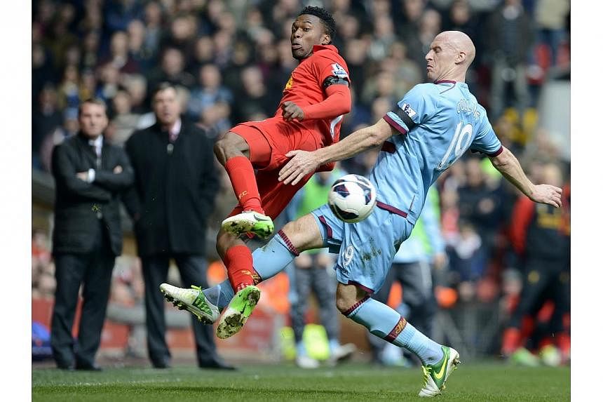 West Ham United's James Collins (right) challenges Liverpool's Daniel Sturridge during their English Premier League soccer match at Anfield in Liverpool, northern England on April 7, 2013.&nbsp;Liverpool striker Daniel Sturridge says he is ready to s