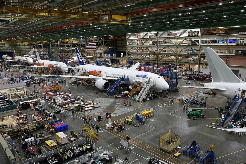 The Boeing 787 Dreamliner assembly line in Seattle, USA, on Jan 29, 2015. Budget carrier Scoot marked a new chapter in its history, after it collected the first of its Boeing 787 jets on Sunday. -- ST PHOTO: WANG HUI FEN