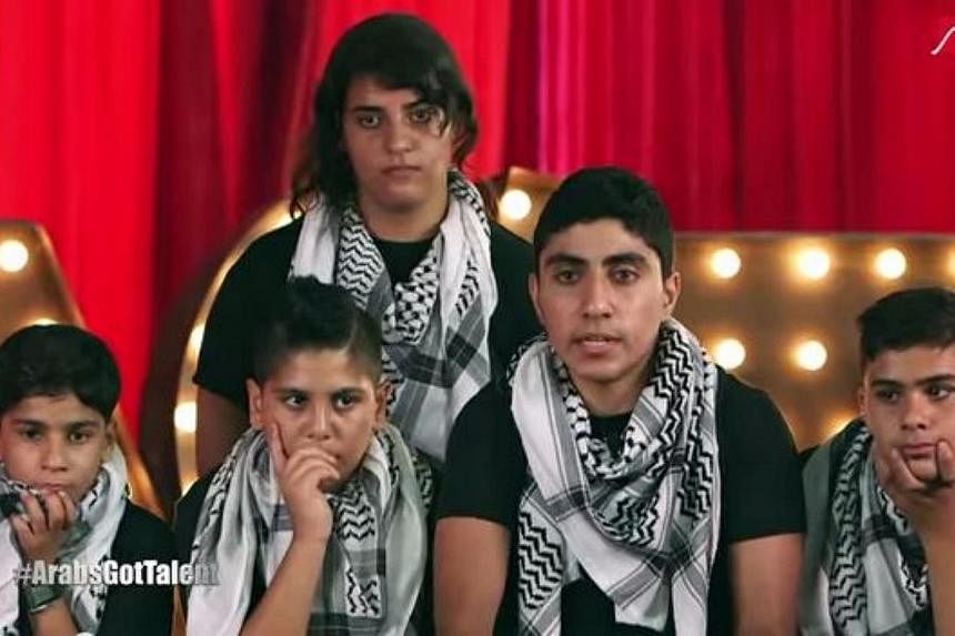 The five young musicians in chequered black-and-white scarves who brought the house on the hugely popular "Arabs Got Talent" TV show in Beirut last month. -- PHOTO: SCREENGRAB FROM YOUTUBE&nbsp;