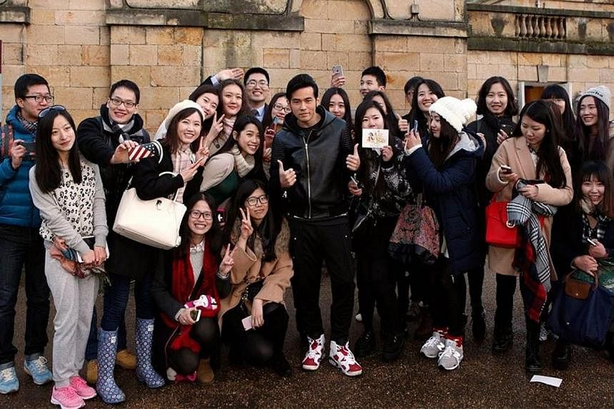 Jay Chou posing for photographs with fans who turned up at his wedding.&nbsp;-- PHOTO: JAY CHOU/FACEBOOK