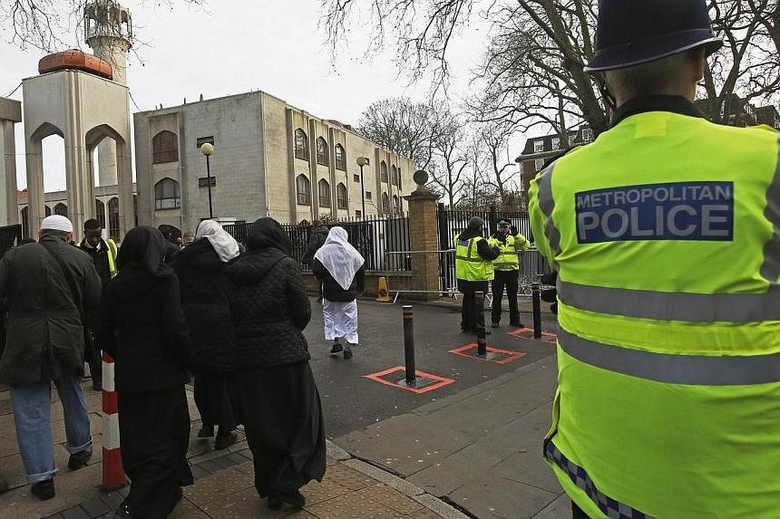 Police carry out a regular patrol as worshippers arrive at the London Central Mosque at Regent's Park in London on Jan 9, 2015.&nbsp;Some 20 mosques in Britain were opening their doors to the public on Sunday, Feb 1, in an unprecedented gesture of re
