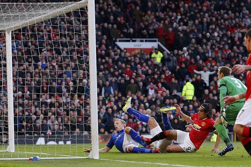 Manchester United's Radamel Falcao (centre) taps the ball in to score during their English Premier League soccer match against Leicester City at Old Trafford in Manchester, northern England Jan 31, 2015. -- PHOTO: REUTERS