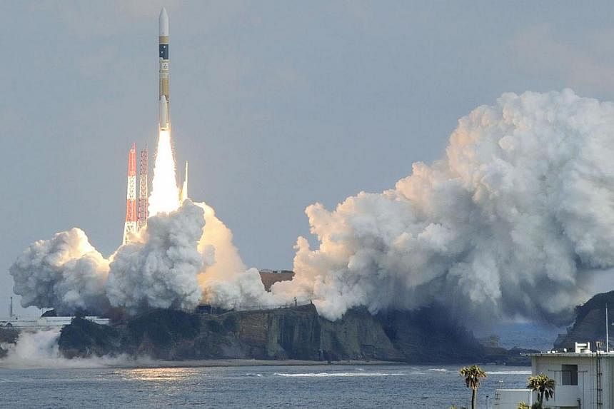 A H-IIA rocket, carrying a backup radar satellite for intelligence gathering by the government, lifts off from the launching pad at Tanegashima Space Center on the Japanese southwestern island of Tanegashima, in this photo taken by Kyodo on Feb 1, 20