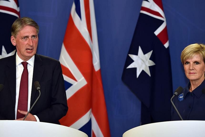 British Secretary of State for Foreign and Commonwealth Affairs Philip Hammond (left) speaking to reporters with Australian Foreign Minister Julie Bishop during defence talks in Sydney on Feb 1, 2015.&nbsp;The two foreign ministers slammed the killin