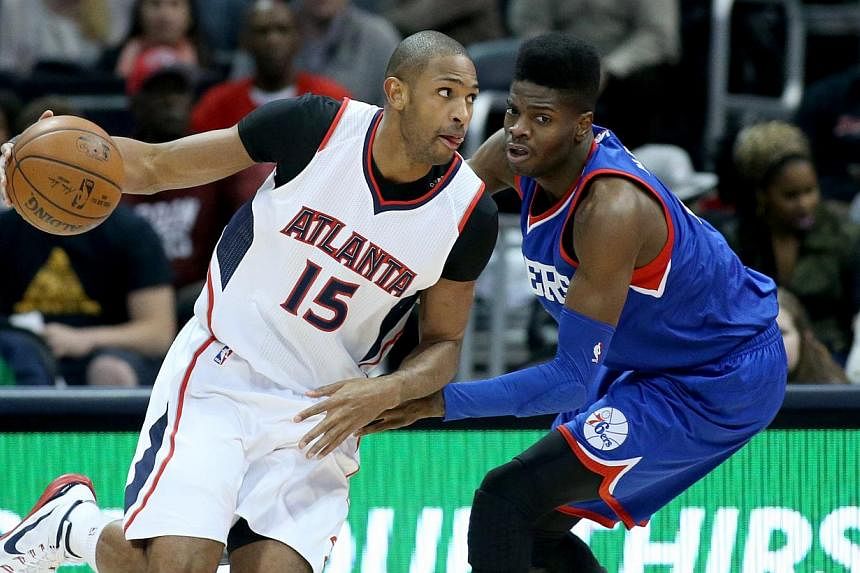 Atlanta Hawks centre Al Horford (15) drives against Philadelphia 76ers center Nerlens Noel (4) in the first quarter of their game at Philips Arena on Jan 31, 2015. -- PHOTO: JASON GETZ/USA TODAY SPORTS&nbsp;