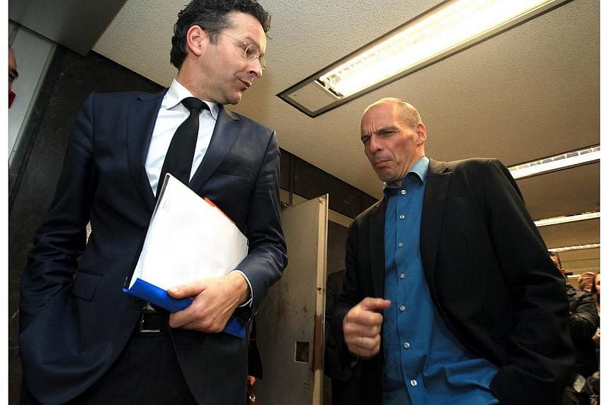 A sartorial shift in gear is among the most obvious changes with Greece's new government, as seen at Friday's meeting between untucked Finance Minister Yanis Varoufakis (above right) and the sharp-suited head of the Eurogroup, Jeroen Dijsselbloem (ab