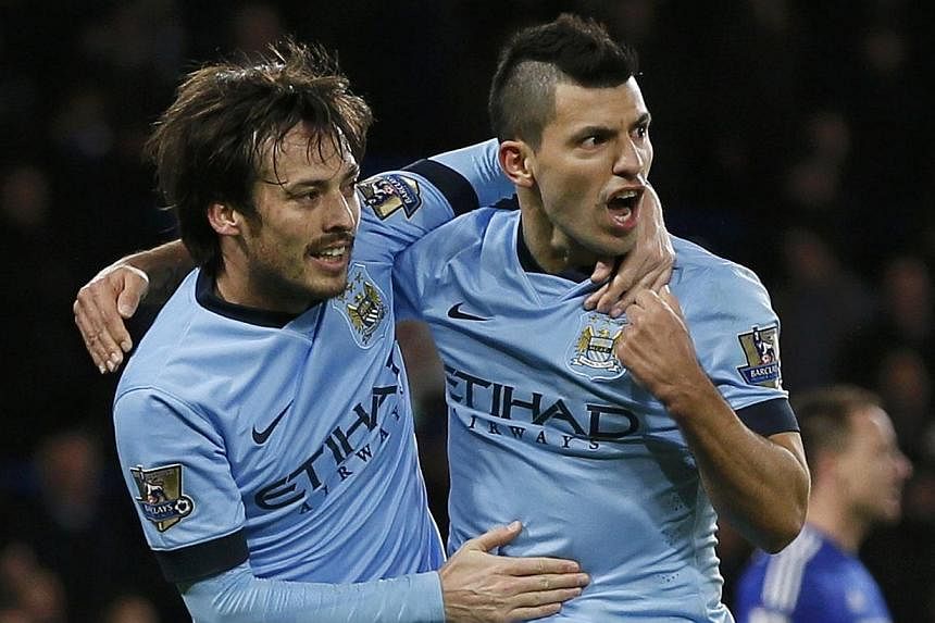 Manchester City's David Silva (left) celebrates his goal with teammate Sergio Aguero during their English Premier League soccer match against Chelsea at Stamford Bridge in London Jan 31, 2015. -- PHOTO: REUTERS