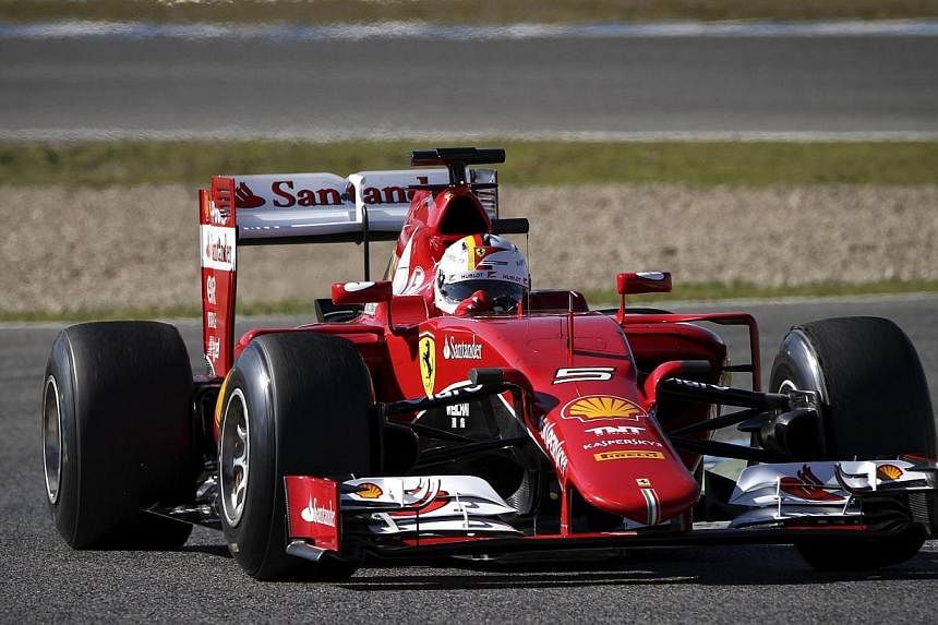 Ferrari Formula One driver Sebastian Vettel of Germany steers his car during a training session at Jerez racetrack in Jerez de la Frontera, Spain, on Sunday, Feb 1, 2015. The four-time world champion continued his positive start to life with Ferrari,