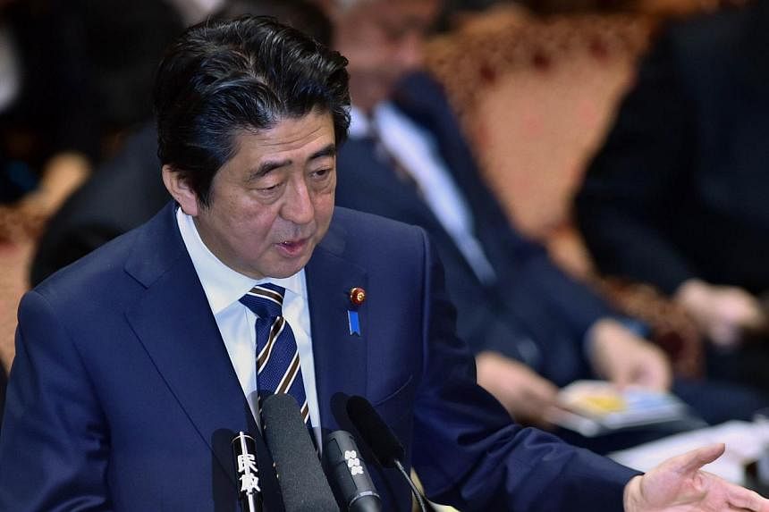 Japanese Prime Minister Shinzo Abe answers a question by an opposition lawmaker during the Upper House's budget committee session at the National Diet in Tokyo on Feb 2, 2015. Mr&nbsp;Abe said he wanted to debate the possibility of Japan's military r