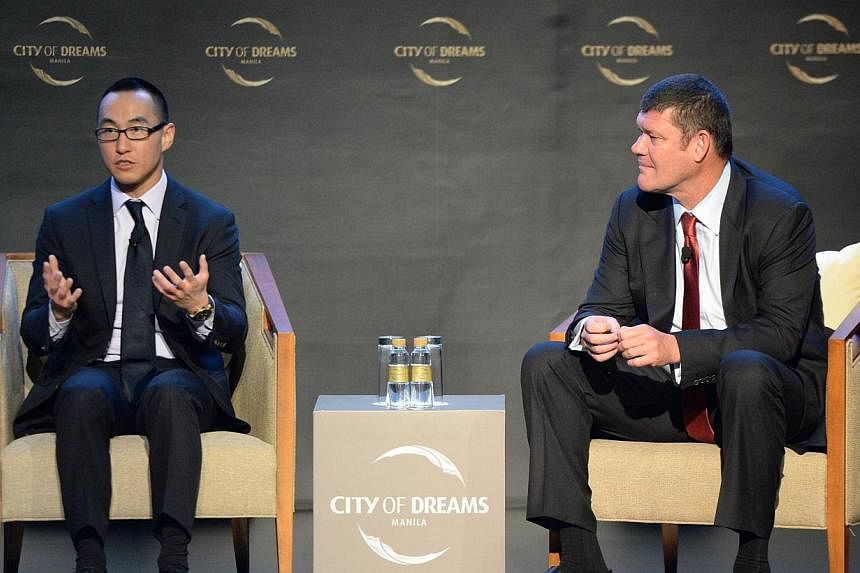 Lawrence Ho (left), son of Macau gaming tycoon Stanley Ho, and co-chairman of Melco crown speaks as his co chairman, Australian billionaire James Packer listens during a press conference at the newly-opened City of Dreams mega-casino in Manila on Feb