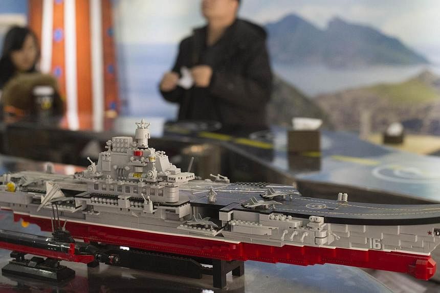 A model of China's first aircraft carrier, the Liaoning. A company has won a contract to supply cabling for a second Chinese aircraft carrier, comments by the local authorities suggested, in the latest sign that Beijing is boosting its maritime power