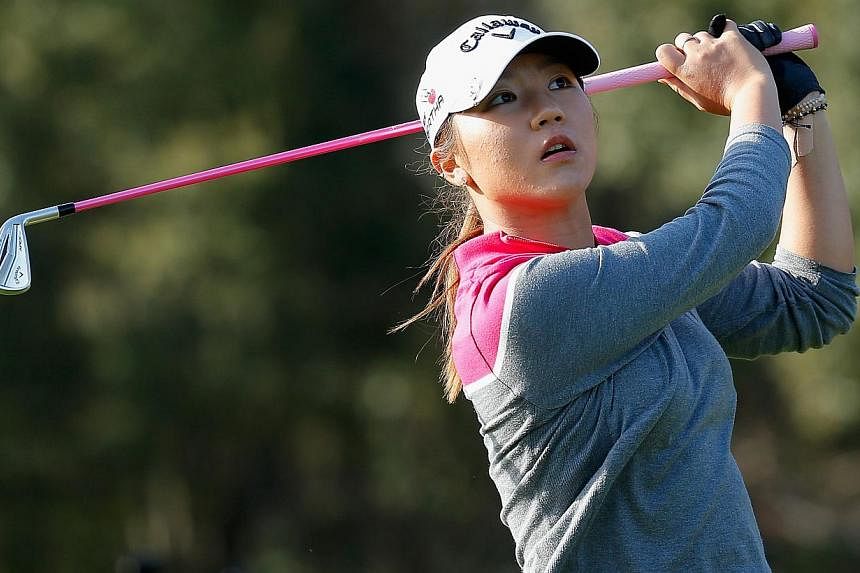 Lydia Ko of New Zealand watches her tee shot on the 15th hole at the Coates Golf Championship Presented by R+L Carriers - Final Round at the Golden Ocala Golf &amp; Equestrian Club on Jan 31, 2015 in Ocala, Florida. -- PHOTO: AFP