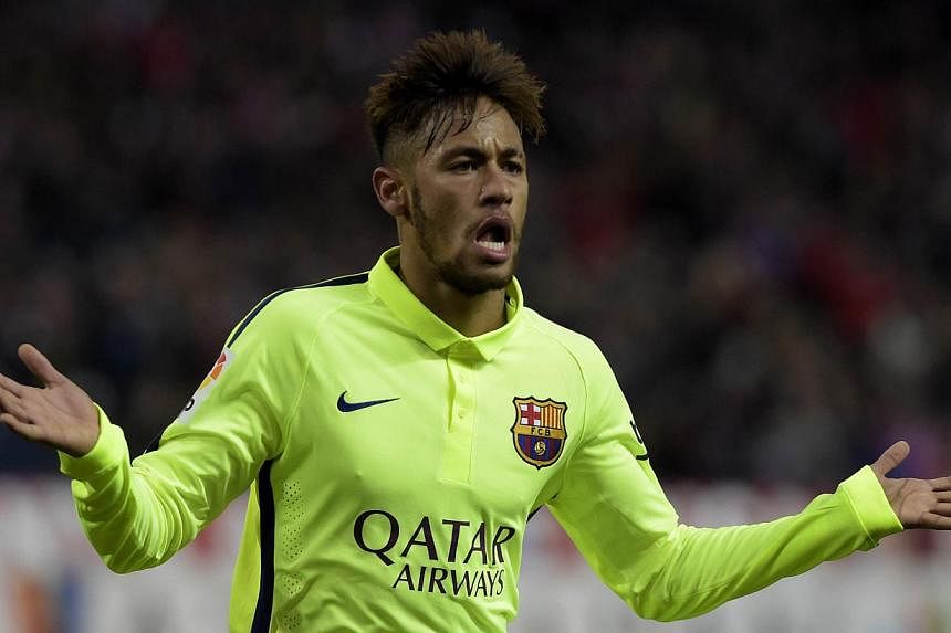 Barcelona's Brazilian forward Neymar celebrates after scoring his second goal during the Spanish Copa del Rey quarter-final second leg against Atletico Madrid at the Vicente Calderon stadium in Madrid on Jan 28, 2015. -- PHOTO: AFP