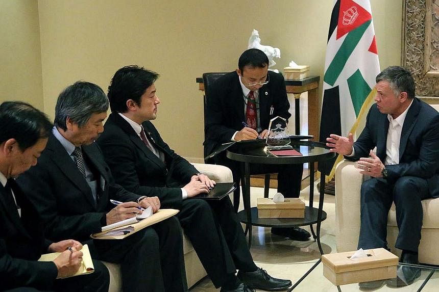 Jordan King Abdullah II (right) meeting with Japanese State Minister for Foreign Affairs Yasuhine Nakayama (third from left) in Amman, Jordan on January 21 in a handout photo released by the&nbsp;Jordanian Royal Palace.&nbsp;The meeting focussed on t