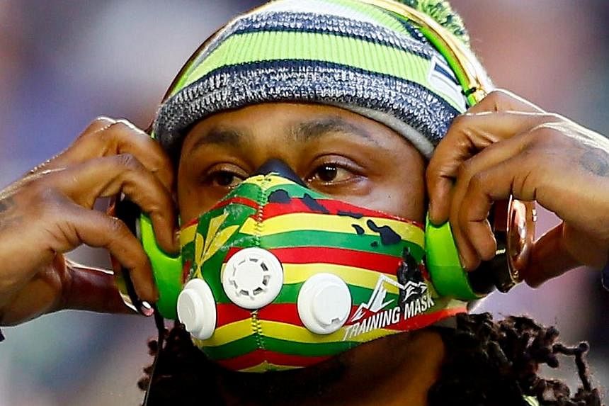 Marshawn Lynch of the Seattle Seahawks warms up prior to Super Bowl XLIX against the New England Patriots at University of Phoenix Stadium this morning in Glendale, Arizona. -- PHOTO: AFP&nbsp;