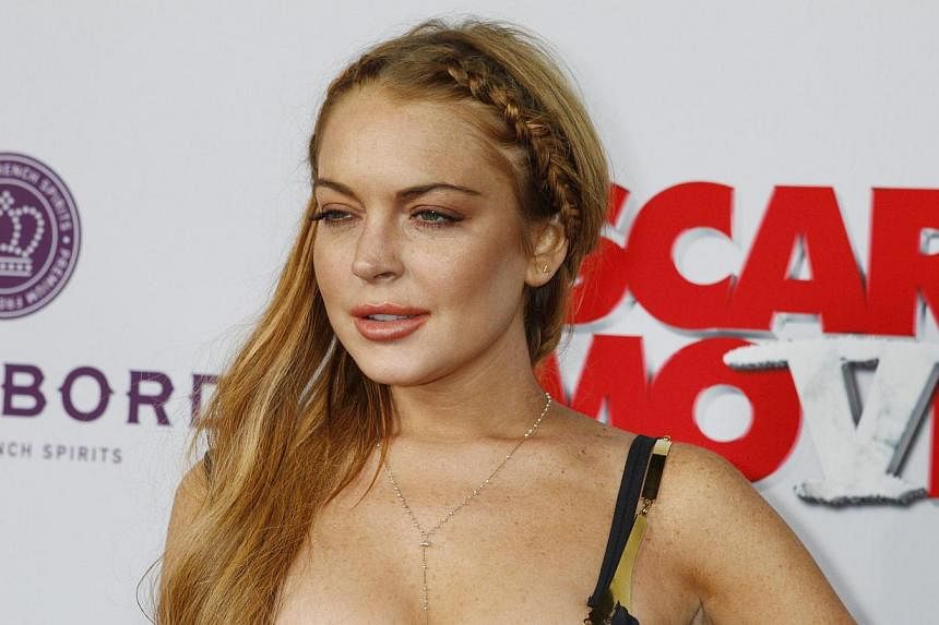 Actress Lindsay Lohan arriving at the premiere of the film Scary Movie 5 in Hollywood on April 11, 2013. -- PHOTO: REUTERS &nbsp;