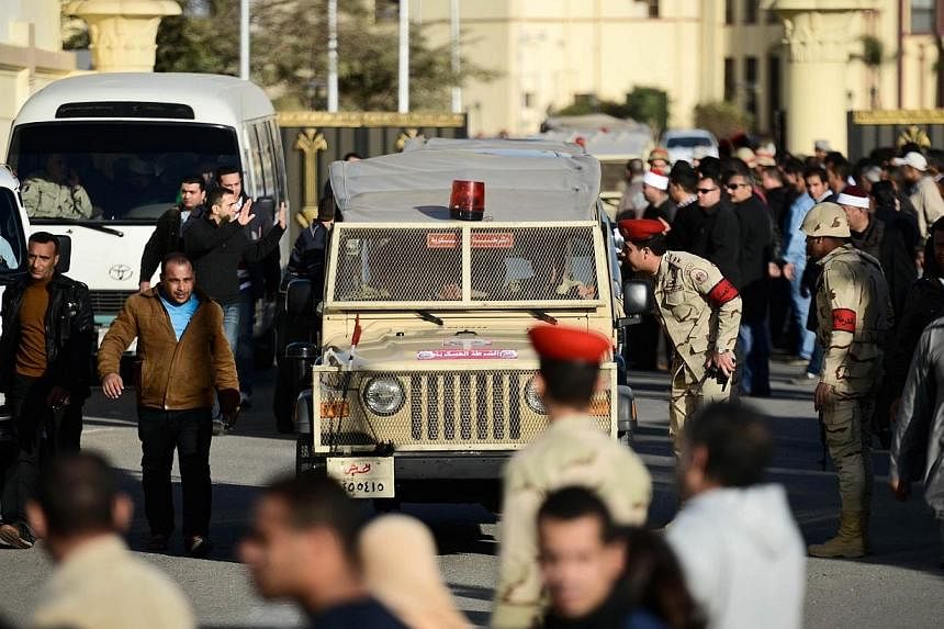 Egyptian members of the armed forces patrol outside al-Maza military airport where the bodies of the members of security forces who were killed in North Sinai province had been flown on Jan 30, 2015 in the capital Cairo.&nbsp;Cairo airport officials 