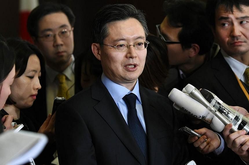 South Korean envoy for North Korean issues Hwang Joon Kook (centre) answers questions after a meeting with his US and Japanese conterparts in Tokyo on Jan 28, 2015. South Korea and China will resume talks this week on efforts to curb North Korea's nu