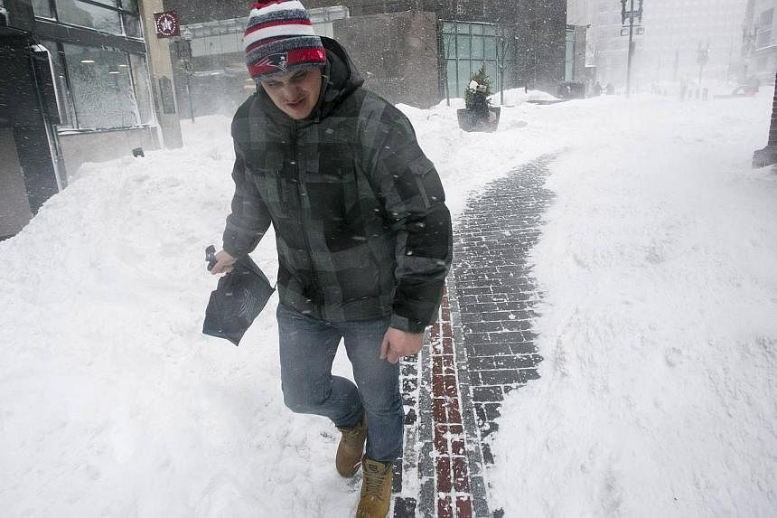 A man walking near the Freedom Trail during a snow storm in Boston, Massachusetts on Feb 2, 2015. -- PHOTO: REUTERS