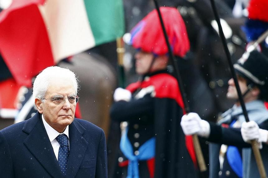 Italy's new President Sergio Mattarella inspects a guard of honour during a welcoming ceremony at the Quirinale presidential palace in Rome, Feb 3, 2015. President Tony Tan Keng Yam has sent a congratulatory letter to Mr Sergio Mattarella who was swo