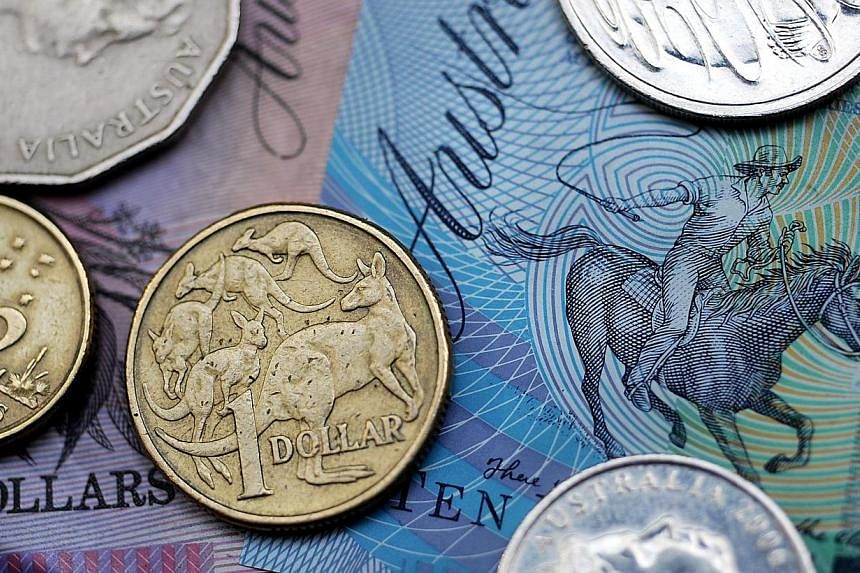 The Aussie dropped as far as $0.7665, from $0.7790, to show a loss of 1.7 per cent for the day. -- PHOTO: BLOOMBERG