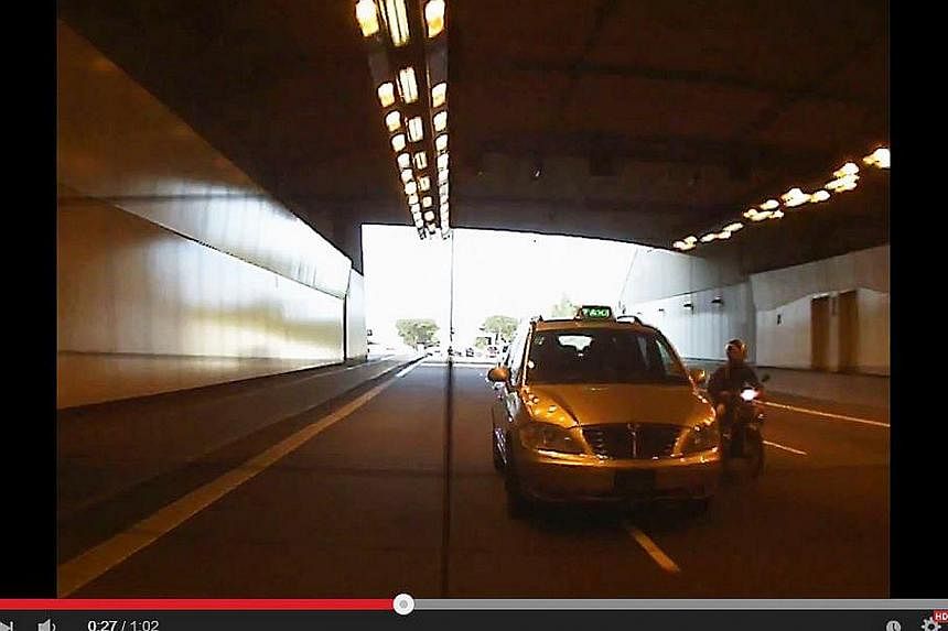 An SMRT taxi driver involved in a road bullying incident has been fired by the company.&nbsp;-- PHOTO:&nbsp;YOUTUBE