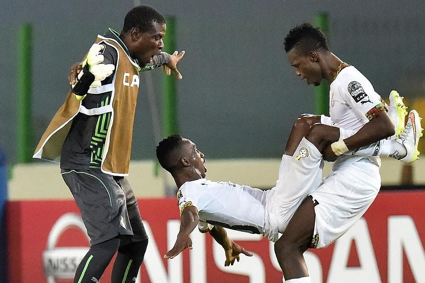 Opponents Ghana were devastating in beating Guinea 3-0 in their quarter-final on Sunday with cleverly created goals but did see captain Asamoah Gyan hurt in a disgraceful tackle right at the end of the game. -- PHOTO: AFP