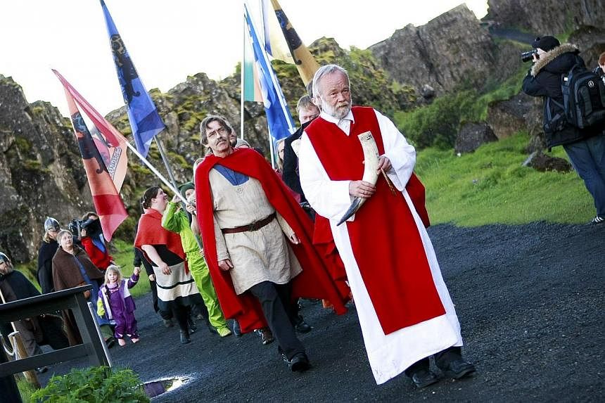 High priest of the Asatru Association, Hilmar Orn Hilmarsson, leading a procession at the Pingvellir National Park near Reykjavik on June 21, 2012. Construction is starting this month on Iceland's first major temple to the Norse gods since the Viking