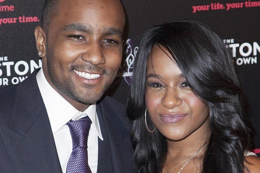 Bobbi Kristina Brown (right) and Nick Gordon attend the opening night of The Houstons: On Our Own in New York, in this file photo taken Oct 22, 2012. Brown, daughter of singer Bobby Brown and his late wife, Whitney Houston, is fighting for her life a