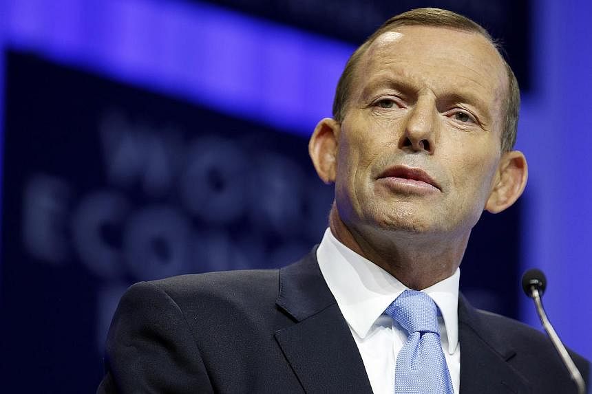 Australian Prime Minister Tony Abbott on Wednesday brushed off a growing threat to his leadership after several backbenchers publicly called for an internal party vote on the top job. -- PHOTO: BLOOMBERG