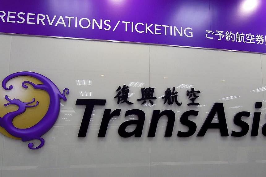 A TransAsia Airways logo at their counter at Taipei Songshan airport in Taipei, Taiwan, 23 July, 2014.&nbsp;Relatives of some passengers on board the TransAsia Airways plane that crashed in Taipei on Wednesday have lashed out at the company for not i