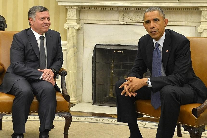 US President Barack Obama (right) speaking with Jordanian King Abdullah II in the Oval Office at the White House, in Washington, DC on Feb 03, 2015. --PHOTO: EPA &nbsp;