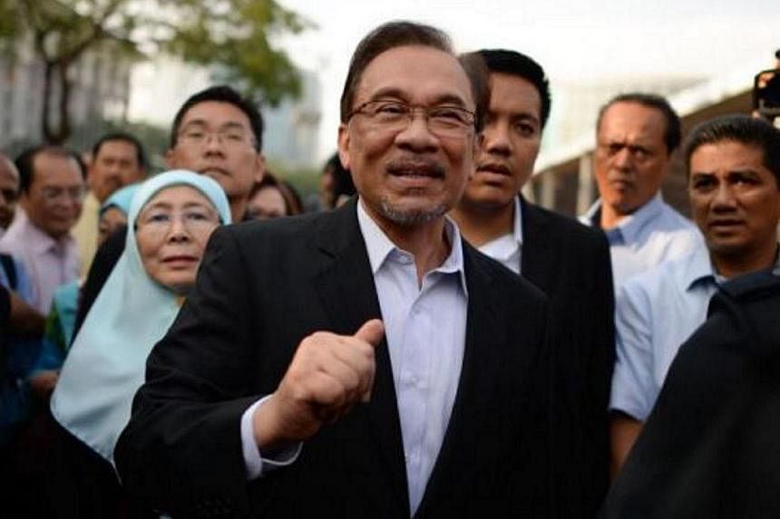 Opposition leader Anwar Ibrahim (centre) said that that any move to jail him next week on controversial sodomy charges could backfire against the Malaysian government. -- PHOTO: THE STAR/ASIA NEWS NETWORK