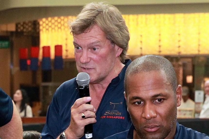 Tottenham Hotspur greats Glenn Hoddle (left) and Les Ferdinand at a soccer clinic conducted for youngsters at the Marina Bay Sands on June 20, 2013.&nbsp;The fall-out from Harry Redknapp's resignation as Queens Park Rangers manager continued on Wedne
