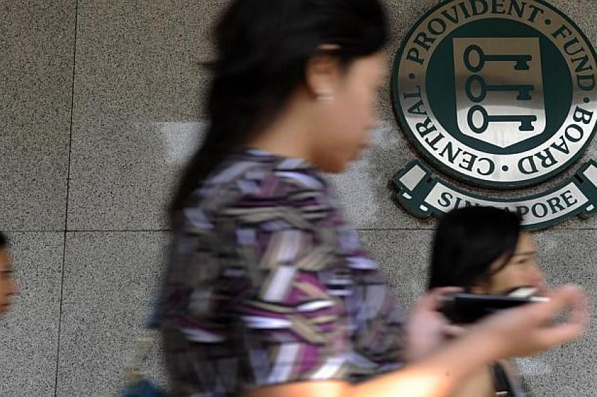 Central Provident Fund (CPF) members should be able to withdraw up to 20 per cent of their savings when they become eligible for monthly payouts at 65, the panel reviewing the scheme has recommended. -- PHOTO: ST FILE