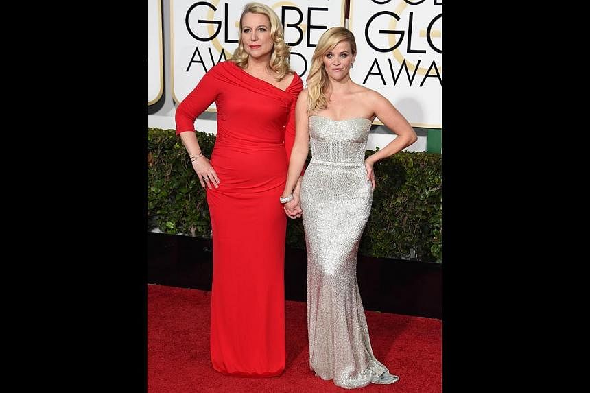 Author Cheryl Strayed (left) with Reese Witherspoon, who plays her in the movie Wild. -- PHOTO: AFP