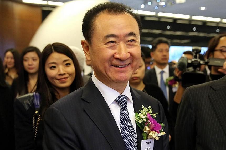 The Dalian Wanda conglomerate of Chinese billionaire Wang Jianlin (above) has bid around US$1 billion (S$1.34 billion) for influential sports marketing giant Infront Sports &amp; Media, according to a report on Wednesday. -- PHOTO: AFP