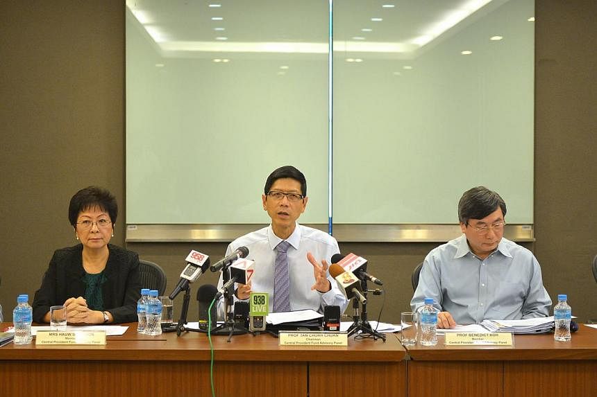 Professor Tan Chorh Chuan (centre) chairing the CPF Advisory Panel press conference to announce its recommendations on how to make the CPF system more flexible on Feb 4, 2015, at the Ministry of Manpower. -- ST PHOTO: ALPHONSUS CHERN