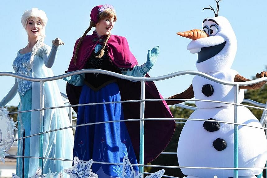 Disney characters from the animated movie Frozen performing on a float during the new parade Anna And Elsa's Frozen Fantasy at Tokyo Disneyland in Urayasu, suburban Tokyo, on Jan 13, 2015. -- PHOTO: AFP