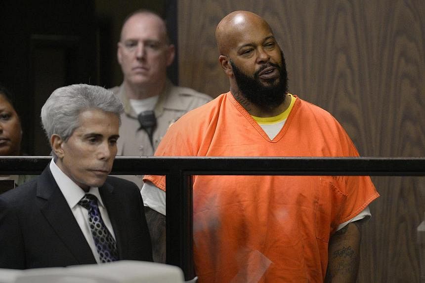 US rapper/music producer Marion 'Suge' Knight (right), next to his attorney David E Kenner, is arraigned on murder charges in Superior Court in Compton, California on Monday. Knight is accused of murder in the hit-and-run death of Terry Carter. Knigh
