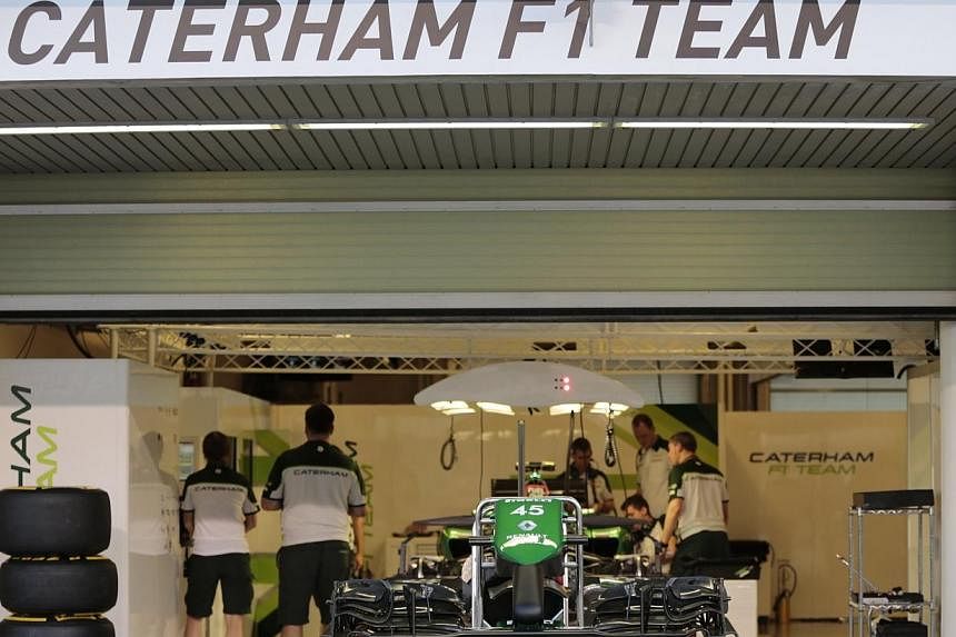 Members of the Caterham Formula One team prepare their car at the Yas Marina circuit before the start of the Abu Dhabi Grand Prix on Nov 20, 2014.&nbsp;Hopes of rescuing the failed Caterham team looked to be over on Thursday, Feb 5, 2014, after aucti