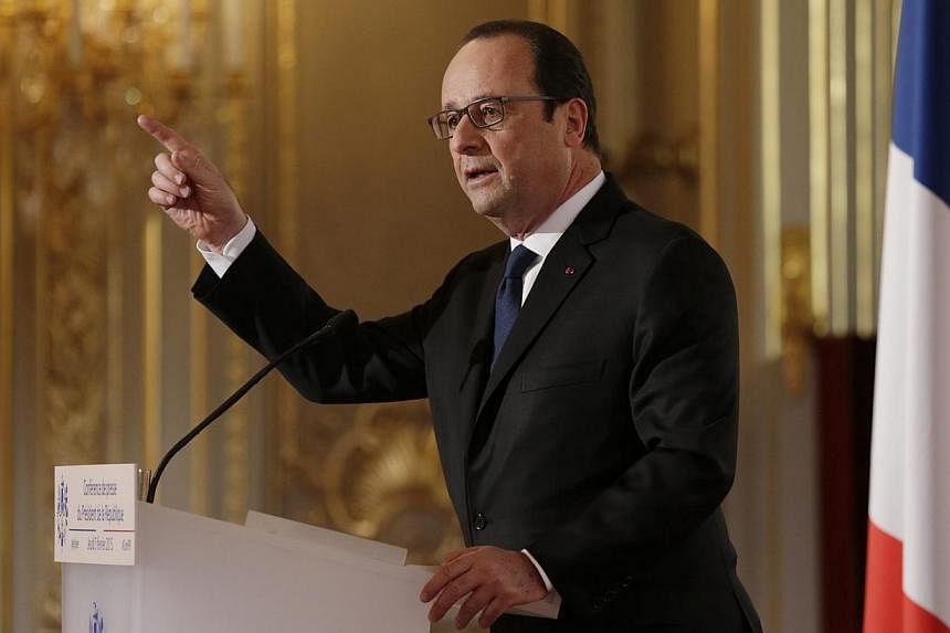 French President Francois Hollande gestures as he answers a question during his biannual press conference at the Elysee Palace in Paris, France, on Feb 05, 2015. Mr Hollande announced he was expanding the country's system of community service, as Fra