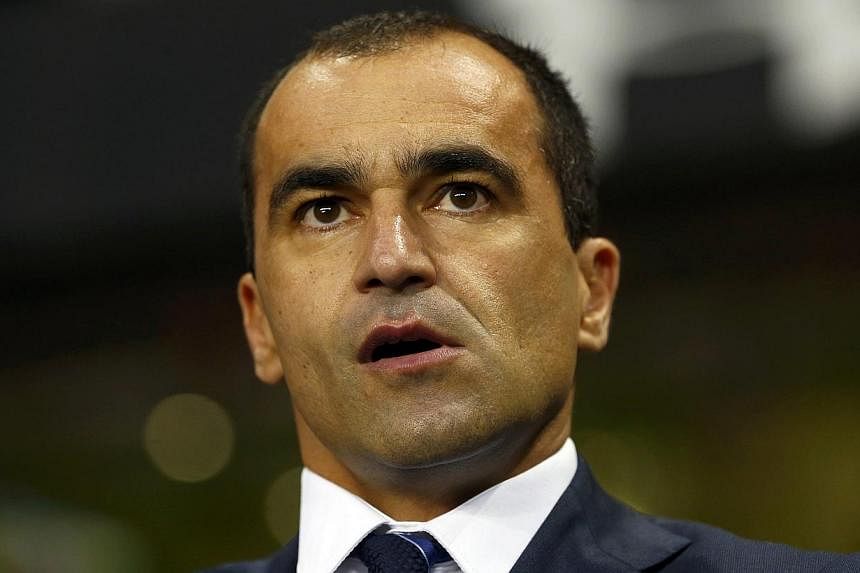 Roberto Martinez watches before their English Premier League soccer match against Tottenham Hotspur at White Hart Lane in London on Nov 30, 2014. The Everton manager says new signing Aaron Lennon can hit the ground running and play a massive role for
