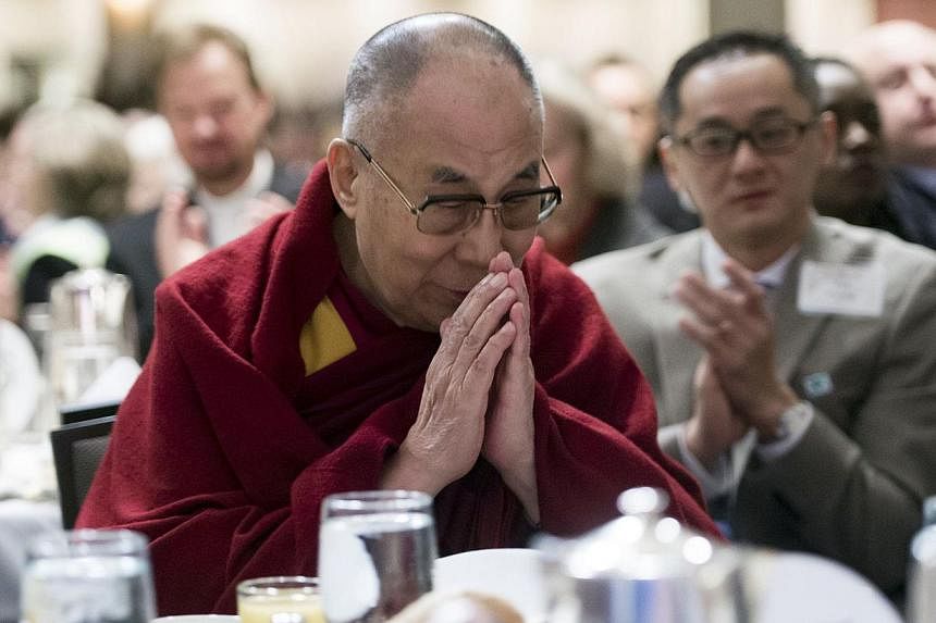 The Dalai Lama is introduced during the National Prayer Breakfast in Washington, DC, Feb 5, 2015. -- PHOTO: AFP